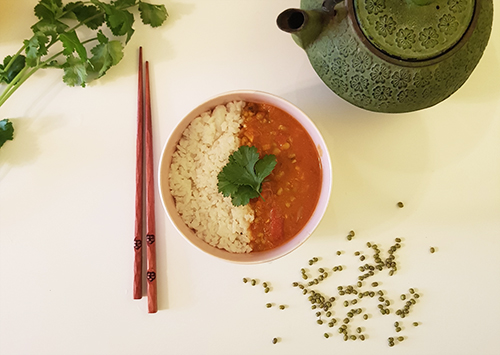 Bowl of vegan dish with mung beans soupe and rice.