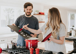 Couple cooking a meal at home.