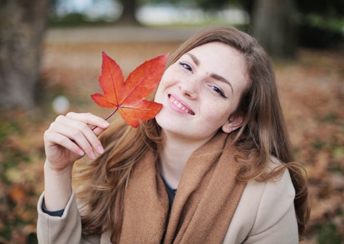 Smiling girl in a forest.