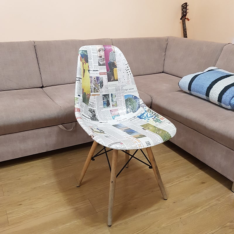 Chair upcycled with newspaper.