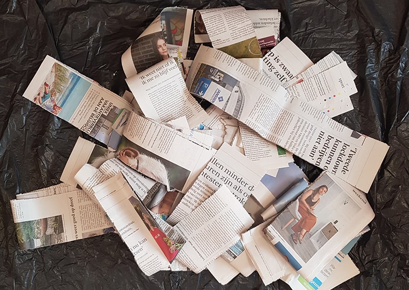 Strips of a reused newspaper.