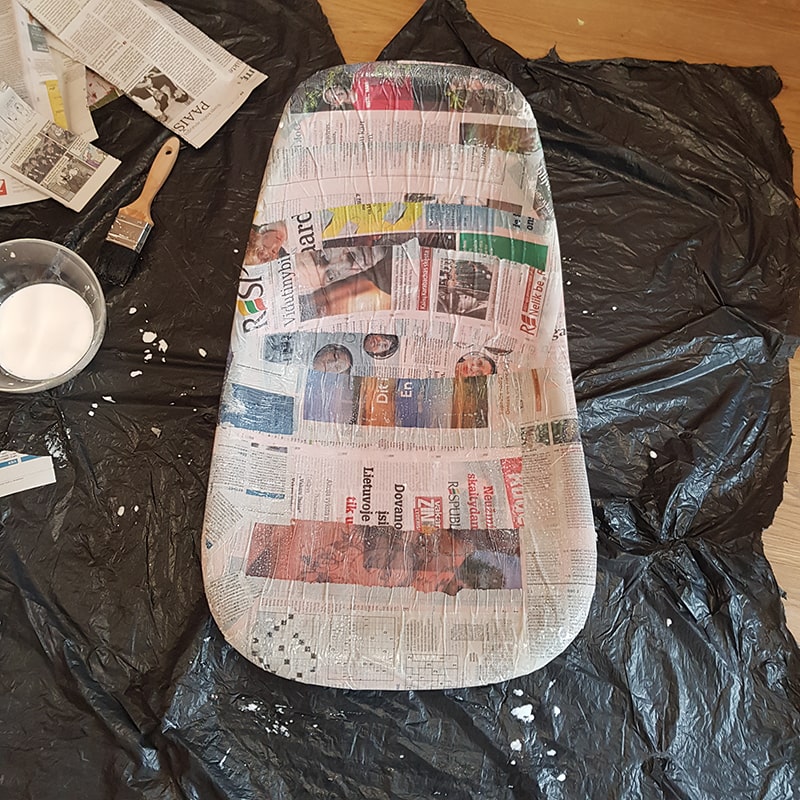 Chair freshly covered of newspaper strips with glue.